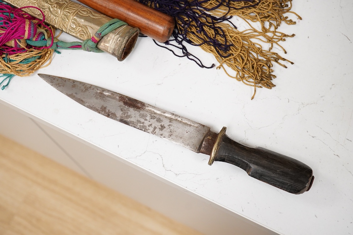 Four Tibetan daggers, early 20th century and a prayer wheel